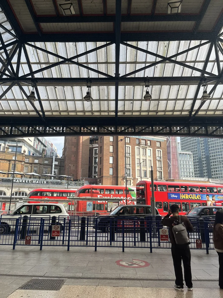 Red buses at Victoria Station, London